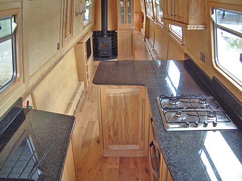 Narrowboat with reverse galley and solid fuel stove