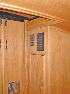 Stern area of GEM45 narrowboat with control panel and service storage cupboard