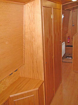 Wardrobe/ storage shown in corridoor to forward bedroom with shower and WC on opposite side