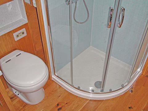 Moder narrowboat layout with shower cubicle and ceramic pump out WC