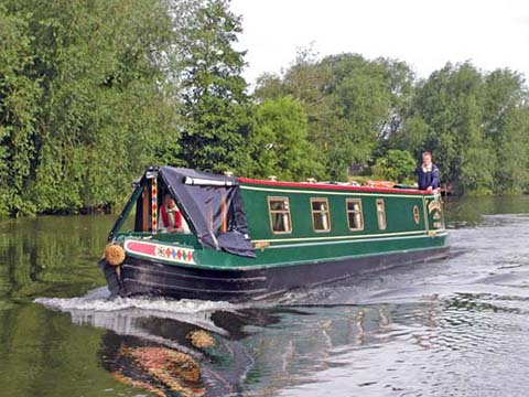 57ft Stenson built narrowboat out cruising on wider waterway 